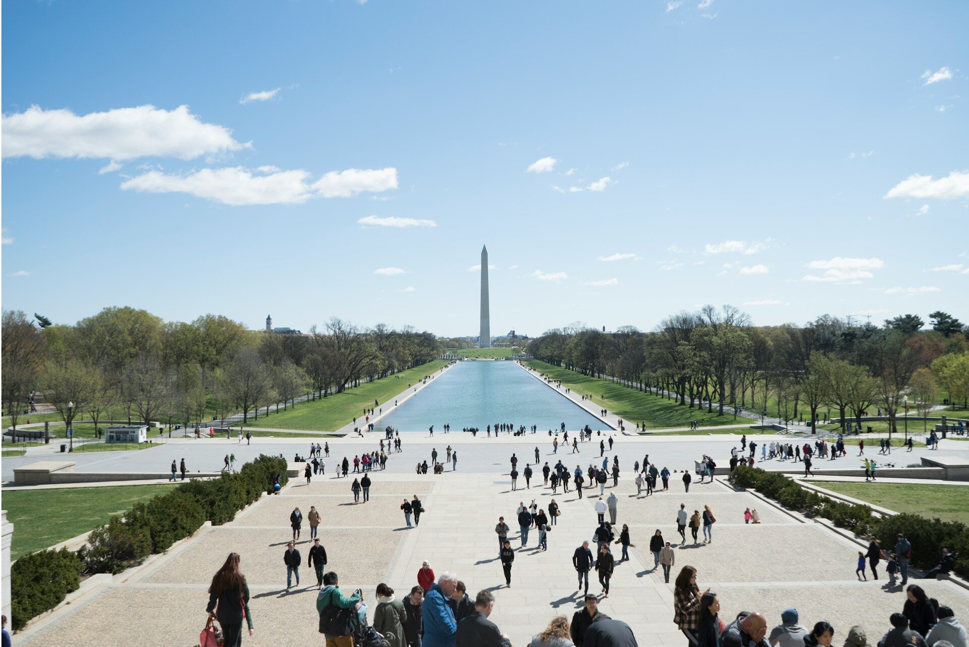 tourists in a park near Washington Monument in DC